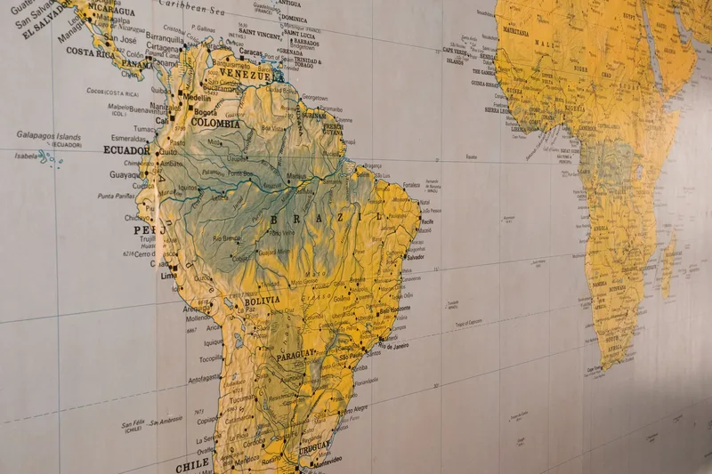 Close-up of a world map, representing the cross-border tax compliance that a merchant of record handles on a seller&rsquo;s behalf