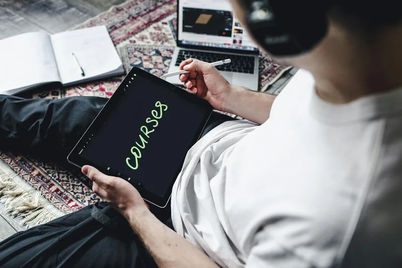 Creator reviewing a course sales page on a clean white interface